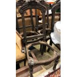 A set of six Continental 19th Century oak dining room chair frames with carved fruit decorated top