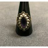 A Victorian gold seed pearl and amethyst mounted dress ring CONDITION REPORTS We