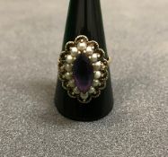 A Victorian gold seed pearl and amethyst mounted dress ring CONDITION REPORTS We