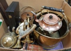 A collection of copper and brass ware to include a pair of ejector candlesticks and a brass coal