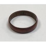 A gold or copper ring inscribed "Napoleon 1856" approx. 3.