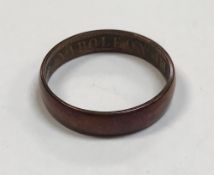 A gold or copper ring inscribed "Napoleon 1856" approx. 3.