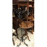 An oak tripod occasional table together with a further oak occasional table and a wrought iron