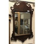 A mahogany framed fretwork carved wall mirror