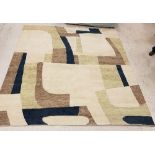 A large modern rug of abstract design in olive brown, blue and cream,