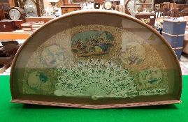 A 19th Century Continental bone fan decorated with hand-coloured engraved panels with figures in