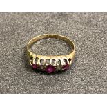 A Victorian 18 carat ring set with rubies and diamonds
