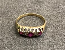 A Victorian 18 carat ring set with rubies and diamonds