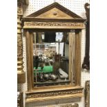 A modern moulded gilt framed wall mirror with bevelled rectangular plate