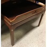 A mahogany butler's tray on a stand with square chamfered legs