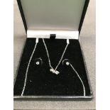 A diamond pendant and earring set