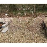 A matching white painted wrought iron garden table,