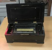 A 19th Century Swiss rosewood and marquetry inlaid music box