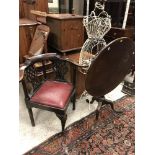 An 18th Century walnut yoke back corner chair,