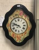 A 19th Century French wall clock within an ebonised frame with painted dial and chapter ring with