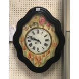 A 19th Century French wall clock within an ebonised frame with painted dial and chapter ring with