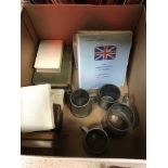 A box containing various pewter tankards, an Aston Martin owners club registar,