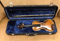 A violin with two piece back and shaped front board,