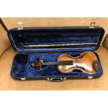 A violin with two piece back and shaped front board,