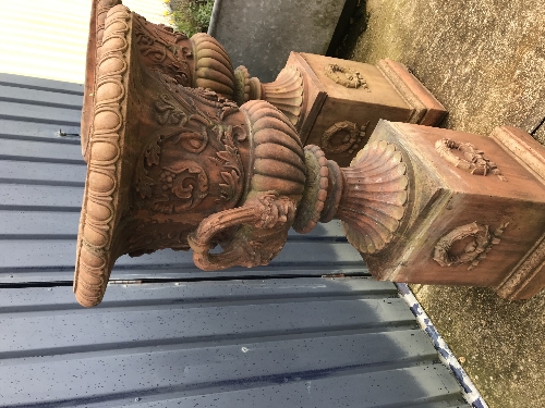 A pair of large terracotta urns on terracotta plinths CONDITION REPORTS One urn has - Image 8 of 13