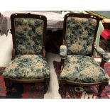 A late Victorian mahogany framed pair of ladies and gentleman's salon chairs with green foliate