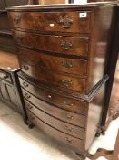 A mid 20th Century burr walnut veneered bow fronted chest on chest of four slim over four deeper