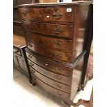 A mid 20th Century burr walnut veneered bow fronted chest on chest of four slim over four deeper