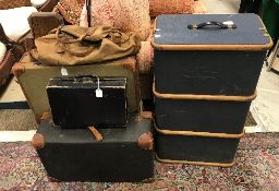 A collection of five various cases to include two leather bound suitcases,