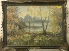 J E KNIGHT "Woodland Scene Overlooking Lake", oil on board, signed lower right,