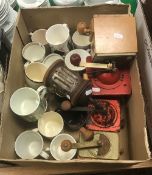 A collection of six various coffee/spice grinders together with a collection of mugs commemorating