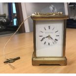 A modern brass five glass carriage clock, the white enamel dial inscribed "Matthew Norman London",