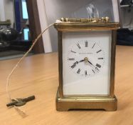 A modern brass five glass carriage clock, the white enamel dial inscribed "Matthew Norman London",