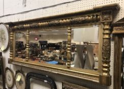 A 19th Century carved giltwood and gesso overmantel mirror with three section plate