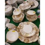 A modern Royal Crown Derby "Green Derby" panel decorated tea set comprising teapot, eight cups,