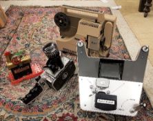 A collection of various cine equipment including a Bolex Zoom Reflex P1 cine camera,