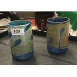 A pair of irridescent blue glass vases indistinctly signed to base