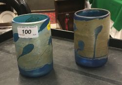 A pair of irridescent blue glass vases indistinctly signed to base