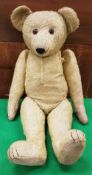 An early 20th Century gold plush bear in the manner of Steiff (no button)