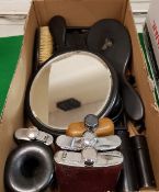 A collection of early 20th Century ebony dressing table wares including brush tidies and mirrors