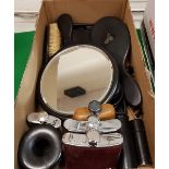 A collection of early 20th Century ebony dressing table wares including brush tidies and mirrors