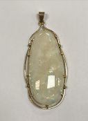 A large Australian opal pendant in 18 carat gold mount