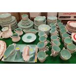 A large collection of Poole twin-tone dinner wares in grey and mint, to include dinner plates,