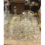 Four various decanters to include a Dartington decanter together with various cut wine glasses and