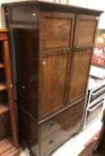 An Edwardian mahogany and cross-banded linen press of small proportions,