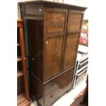 An Edwardian mahogany and cross-banded linen press of small proportions,