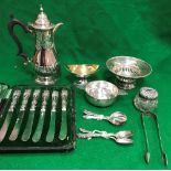 A collection of silver ware to include a Victorian silver hot water jug of small proportions