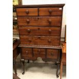 A 19th Century American maplewood tallboy chest on chest the upper section with two short over