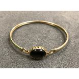 A 9 carat gold set stone bangle