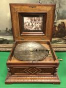 A Victorian walnut cased table top polyphone,