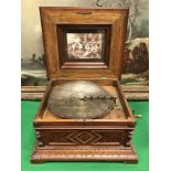 A Victorian walnut cased table top polyphone,